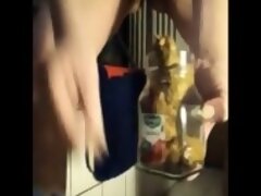 Big lady shitting in a jar and pissing