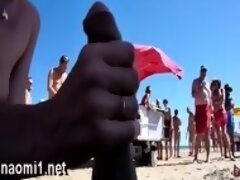 Blonde MILF sucking cock on the beach